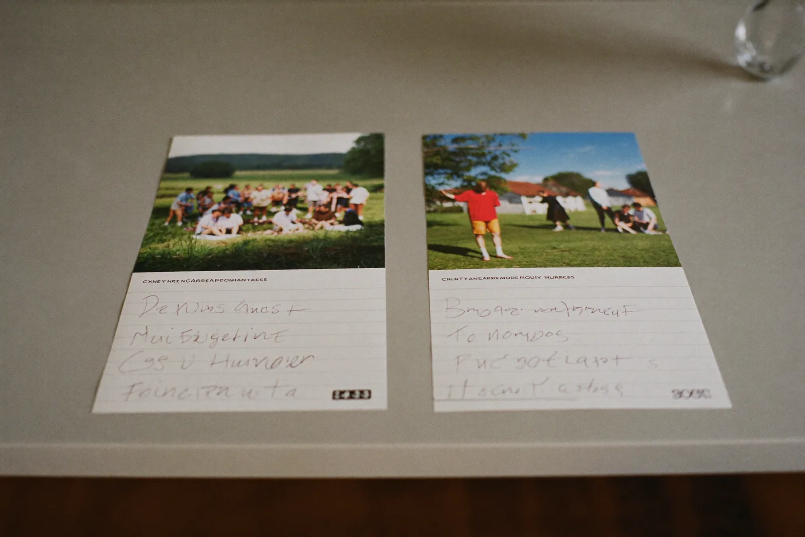 Two community brochures on a table with handwritten pros and cons