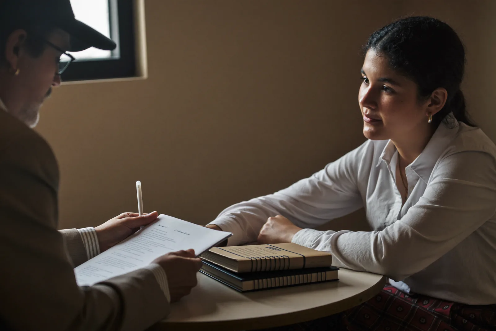 Adult daughter interviewing an advisor with a list of questions