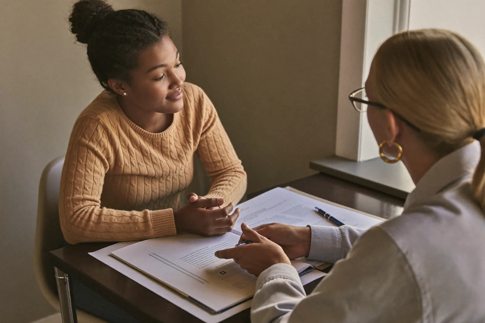 Adult daughter listening to an advisor in an open conversation