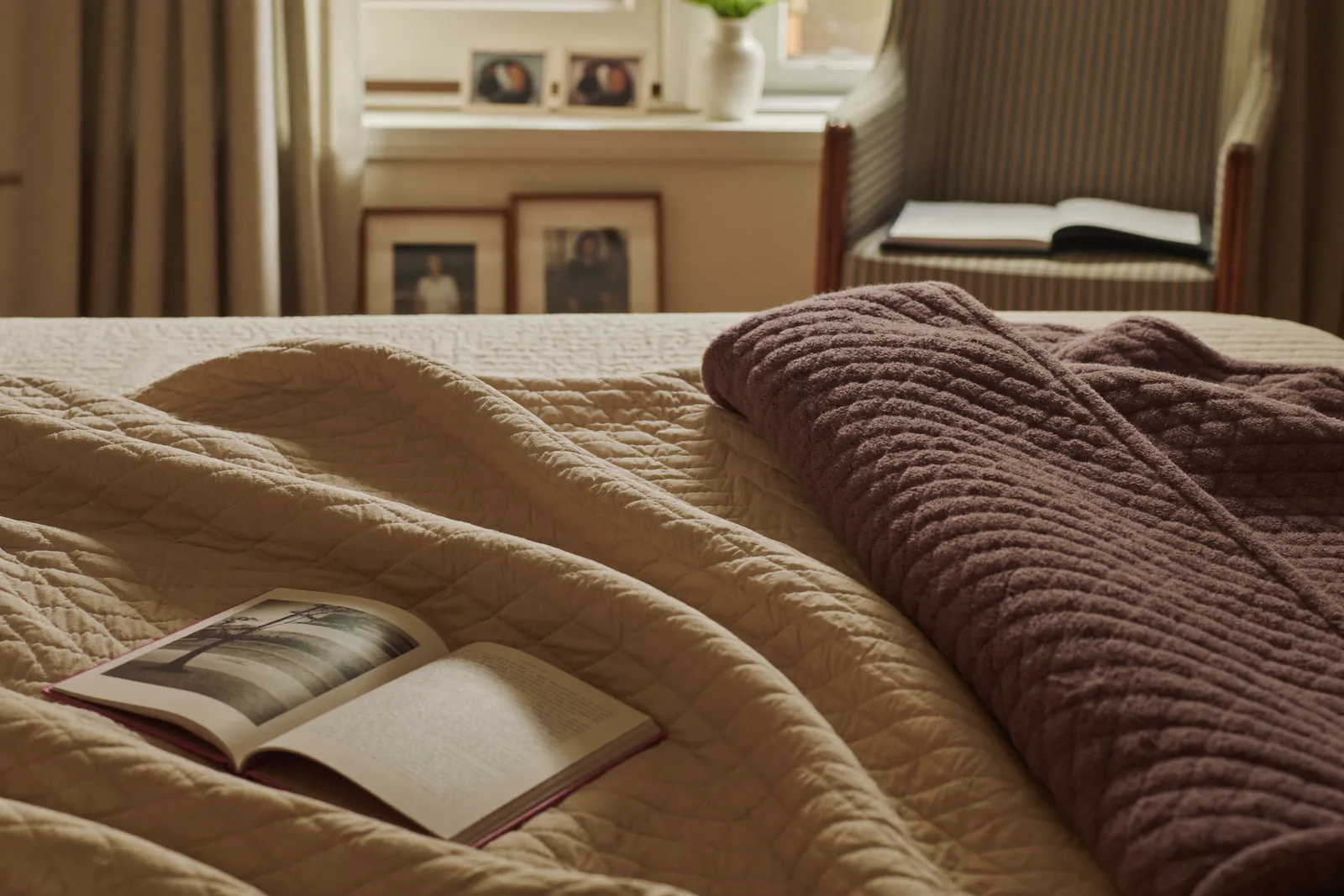 Newly arranged senior apartment with a quilt and reading chair