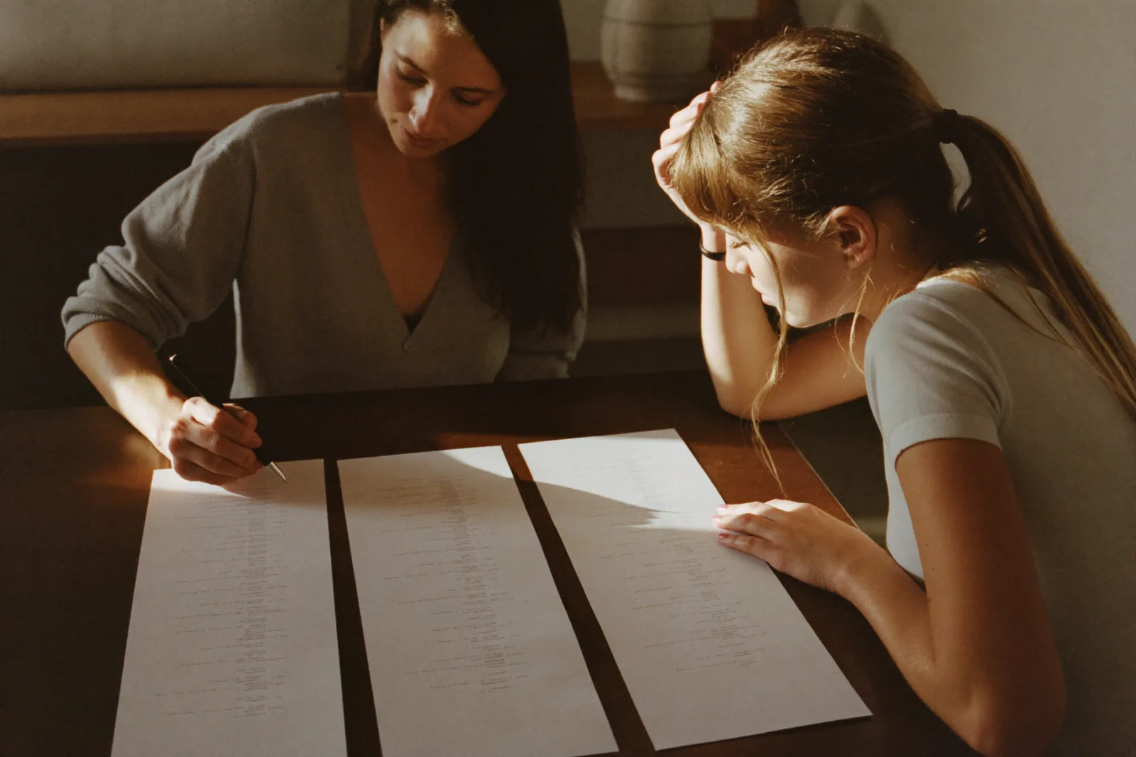 Advisor and daughter narrowing a long list to three options