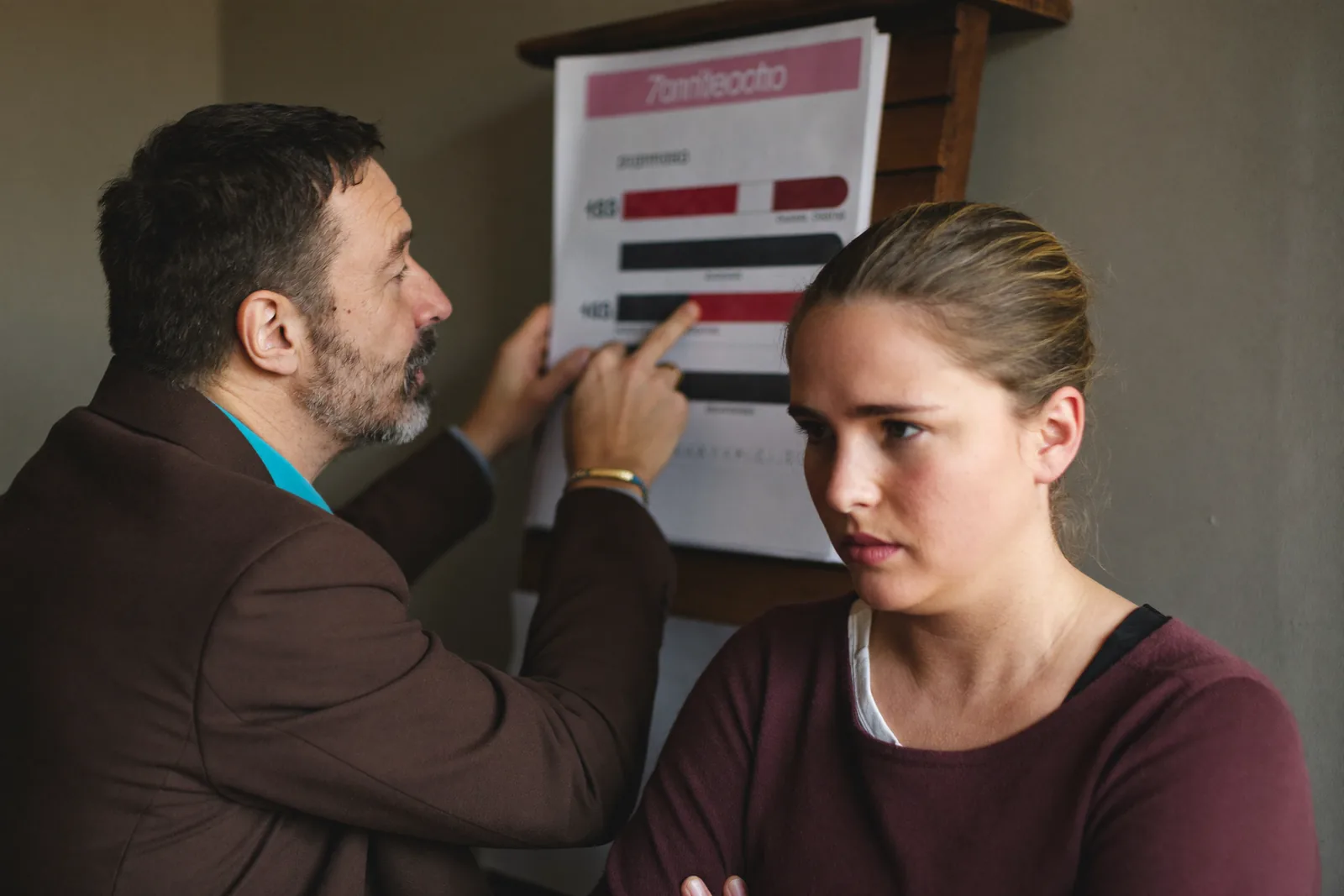 Advisor explaining tradeoffs on a printed cost comparison
